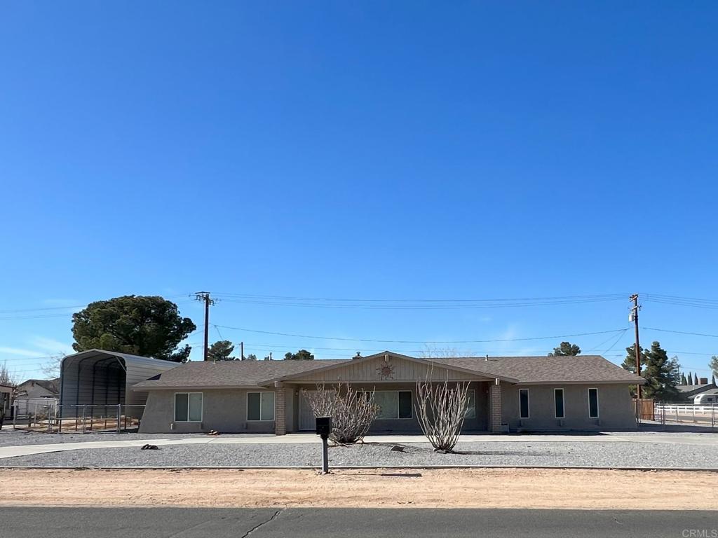 14432 Rincon Road Apple Valley, CA 92307 - Photo 1 of 1 a front view of a house with a yard