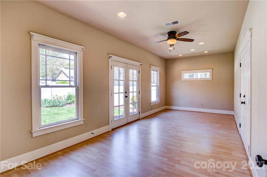 797 Shady Grove Crossing Fort Mill, SC 29708 - Photo 15 of 35 a view of an empty room with a window and wooden floor