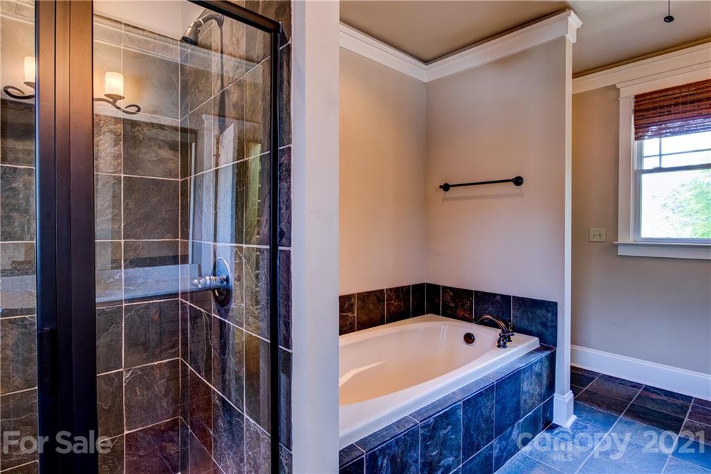 797 Shady Grove Crossing Fort Mill, SC 29708 - Photo 3 of 35 a bathroom with a bathtub and a shower