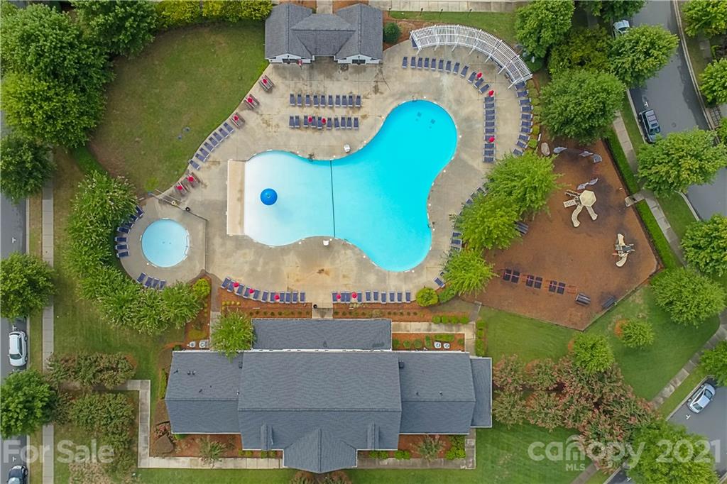 797 Shady Grove Crossing Fort Mill, SC 29708 - Photo 24 of 35 an aerial view of a house with a garden and swimming pool