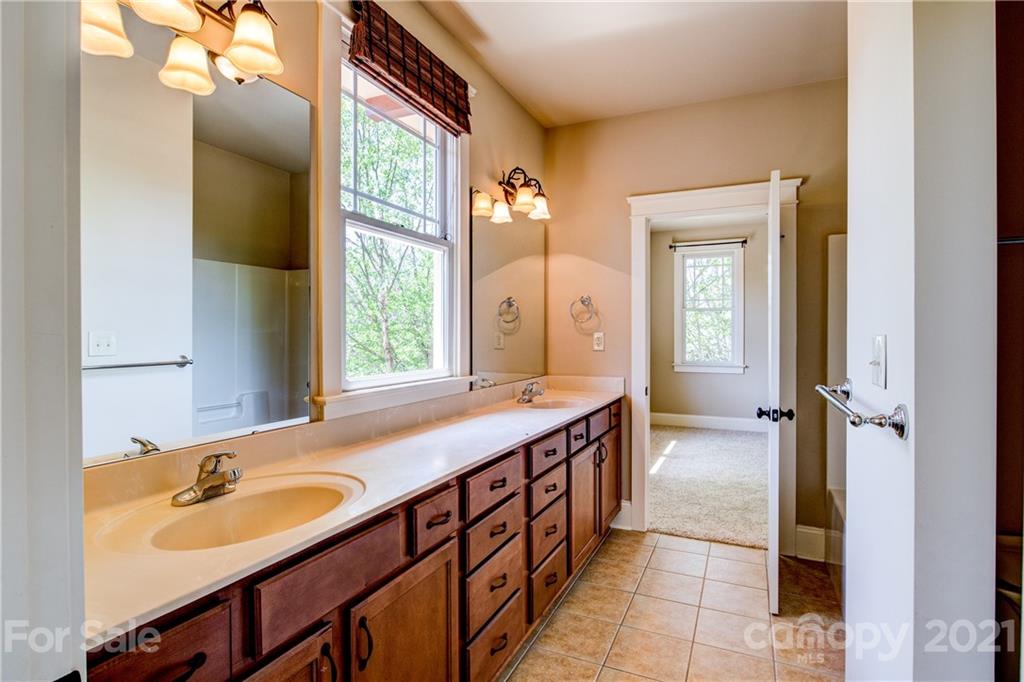 797 Shady Grove Crossing Fort Mill, SC 29708 - Photo 6 of 35 a bathroom with a tub sink and mirror