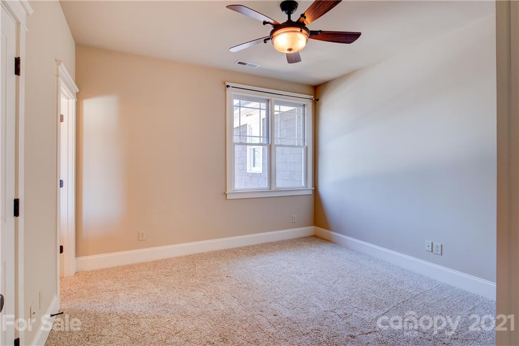 797 Shady Grove Crossing Fort Mill, SC 29708 - Photo 7 of 35 an empty room with windows and fan