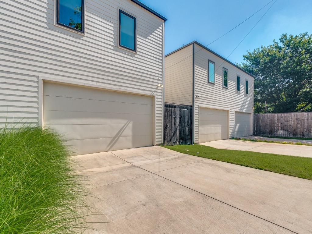 732 West 7th Street Dallas, TX 75208 - Photo 25 of 25 Two-story structures featuring horizontal siding and multiple garage entrances