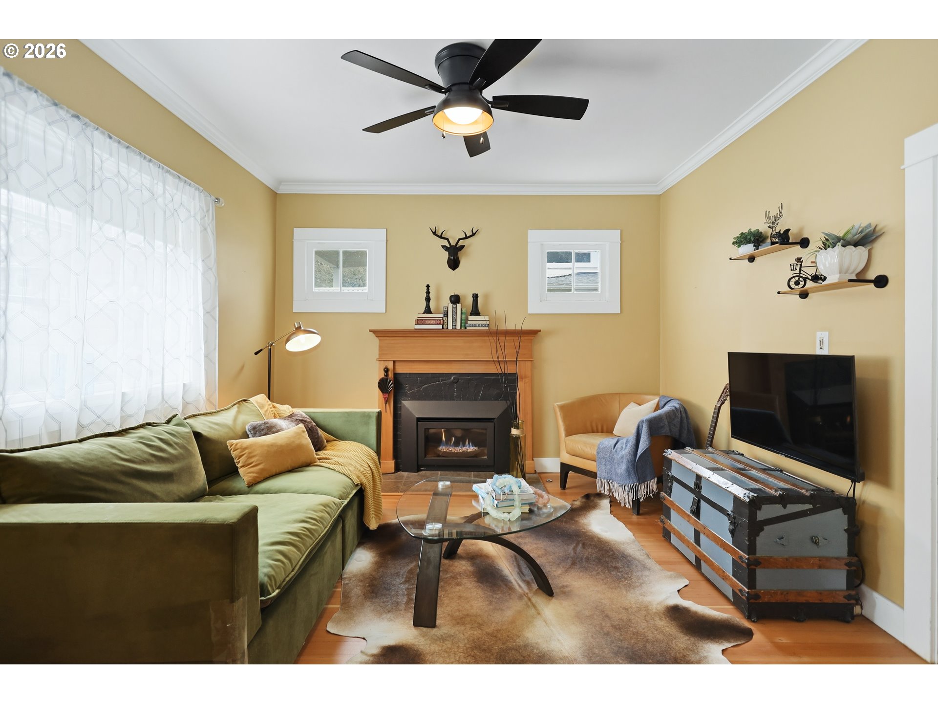 1028 Cascade Avenue Hood River, OR 97031 - Photo 4 of 33 a living room with furniture a fireplace and a flat screen tv