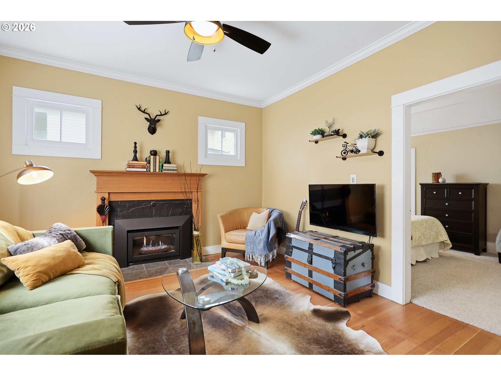 1028 Cascade Avenue Hood River, OR 97031 - Photo 5 of 33 a living room with furniture a fireplace and a flat screen tv