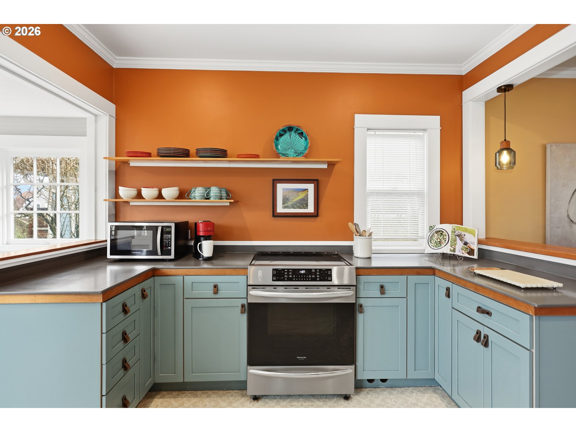 1028 Cascade Avenue Hood River, OR 97031 - Photo 10 of 33 a kitchen with stainless steel appliances granite countertop a stove a sink and a microwave
