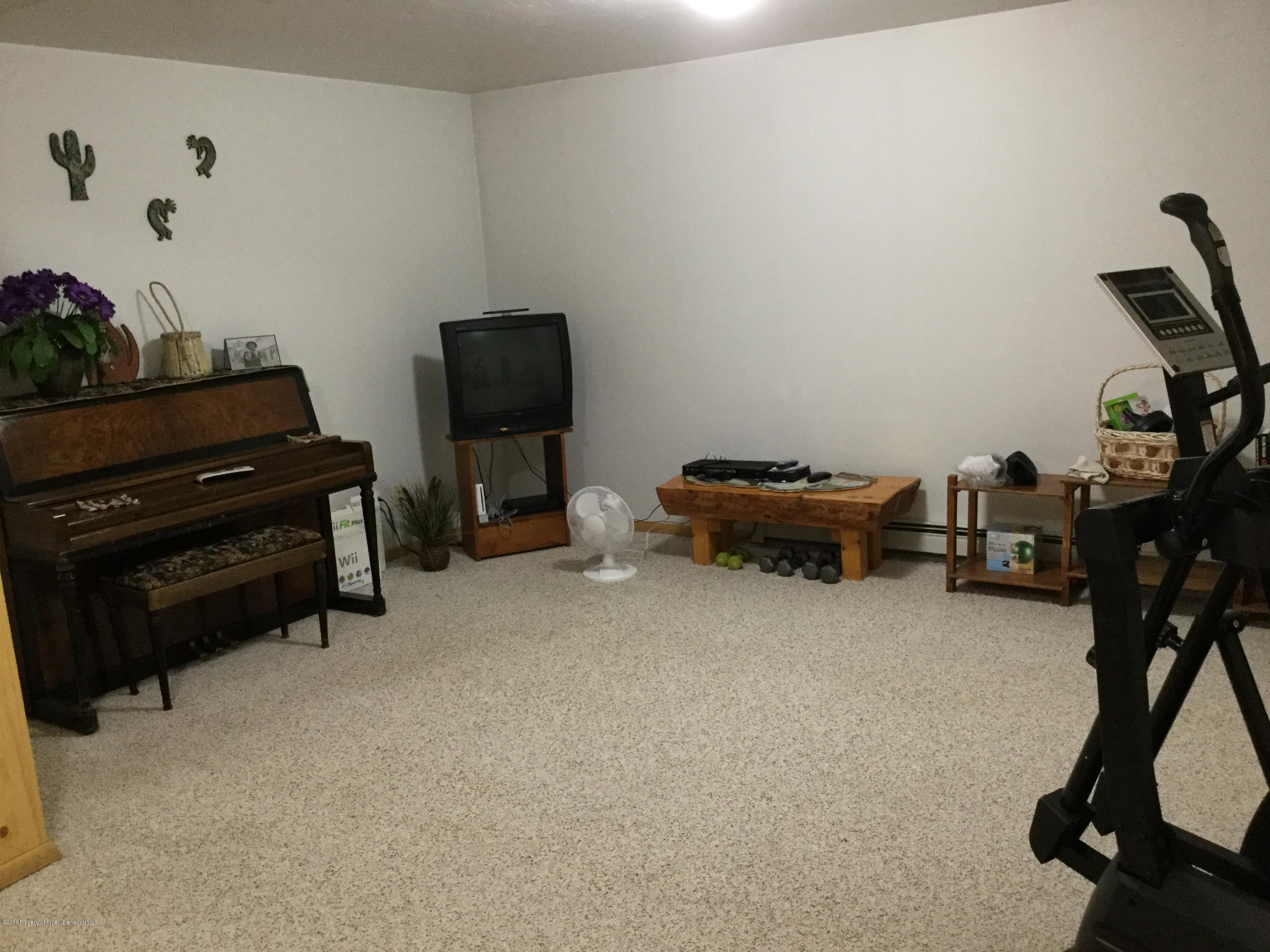 4112 County Road 226 Rifle, CO 81650 - Photo 20 of 34 a room with furniture and a flat screen tv