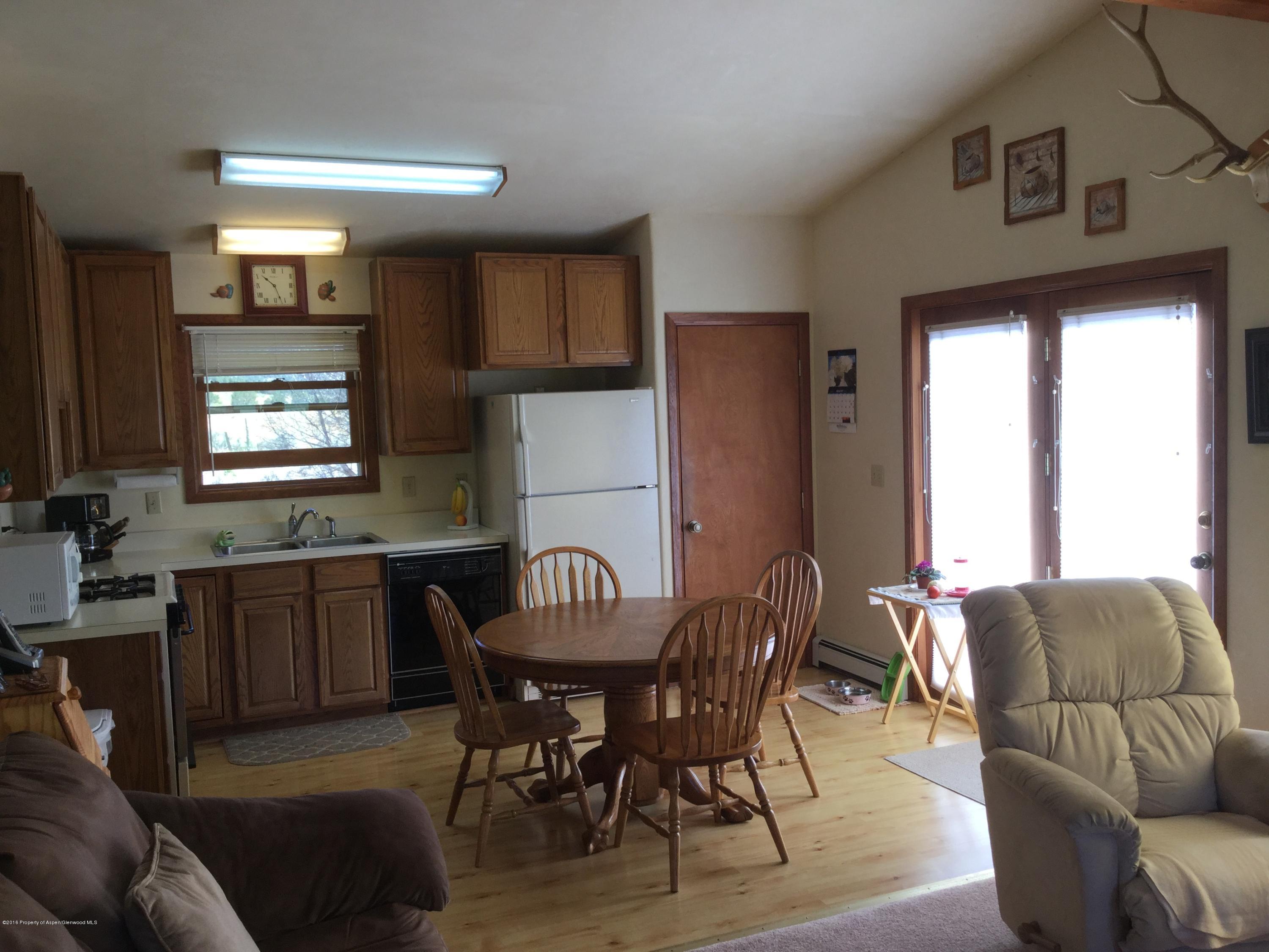 4112 County Road 226 Rifle, CO 81650 - Photo 7 of 34 a view of a livingroom with furniture and window