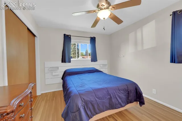 a bedroom with a bed dresser and a window