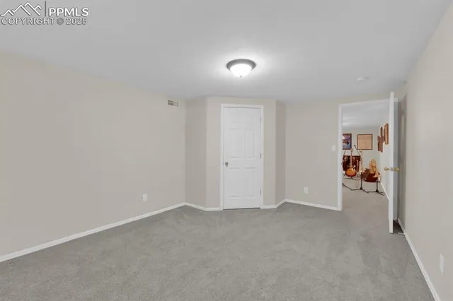 a view of a livingroom with furniture and a flat screen tv