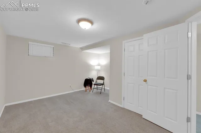 a view of a room with workspace and a couch