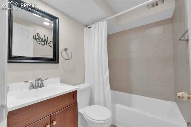 a view of a house with swimming pool next to a yard