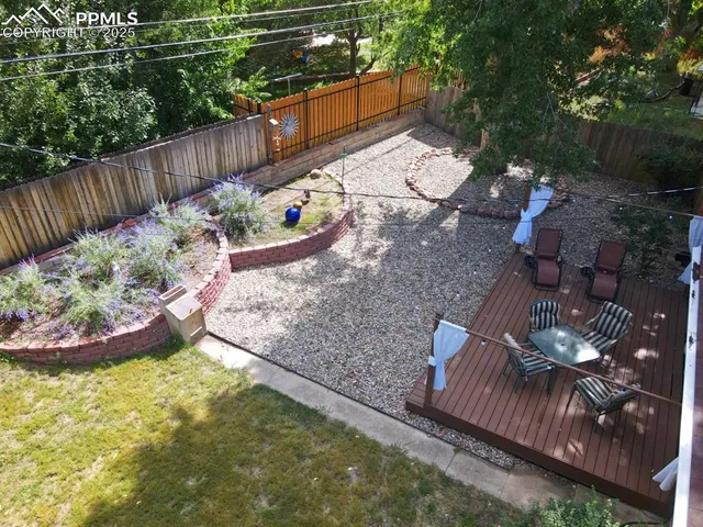 a kitchen with refrigerator cabinets and wooden floor