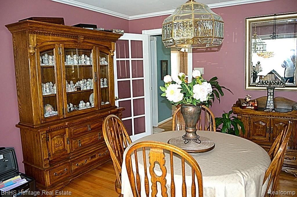 1465 Remsing Street Hartland, MI 48353 - Photo 7 of 27 Formal dining room with hardwood floors, French doors and crown moldings