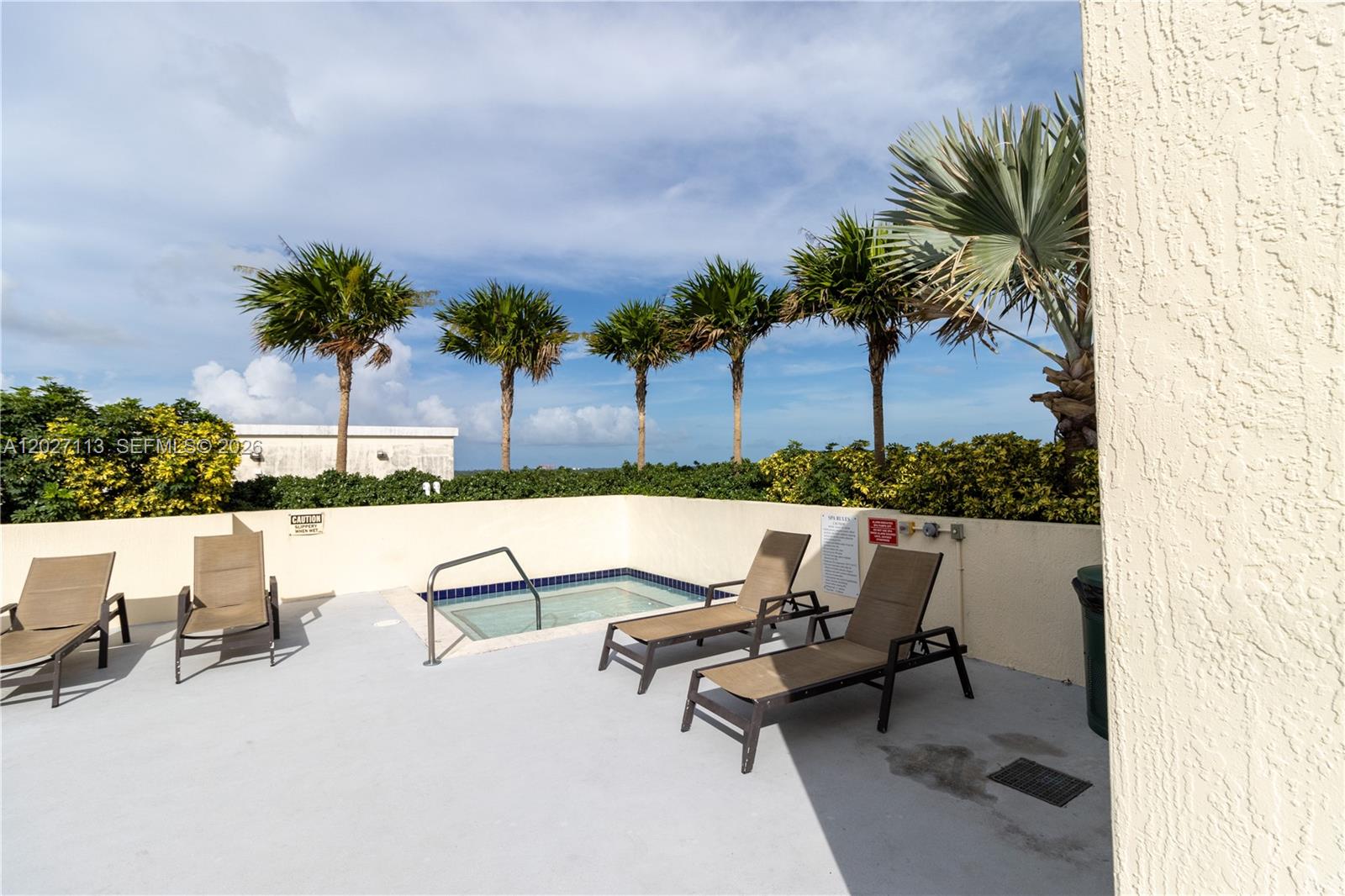7275 Southwest 90th Way, Unit 213 Miami, FL 33156 - Photo 28 of 31 a swimming pool with outdoor seating and yard