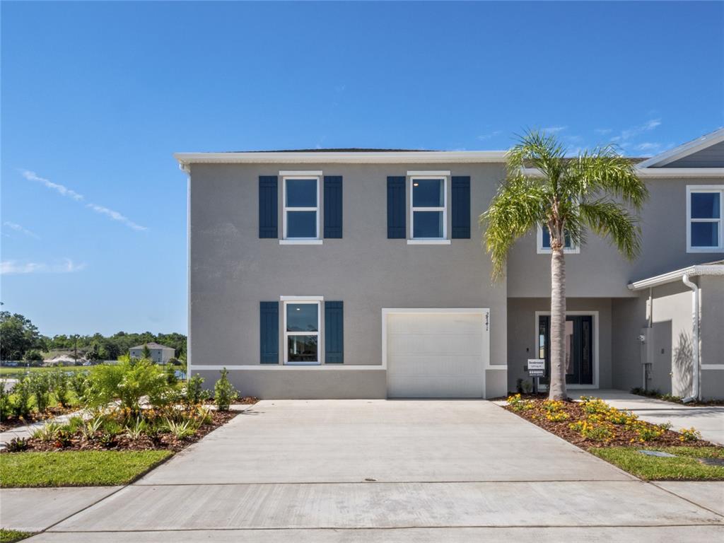 2744 Silver Canoe Drive Edgewater, FL 32141 - Photo 1 of 1 a front view of a house with a yard and a garage