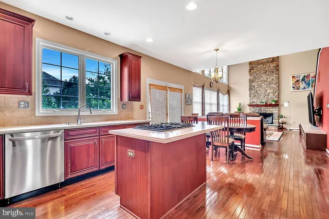 a open kitchen with stainless steel appliances granite countertop a stove and cabinets