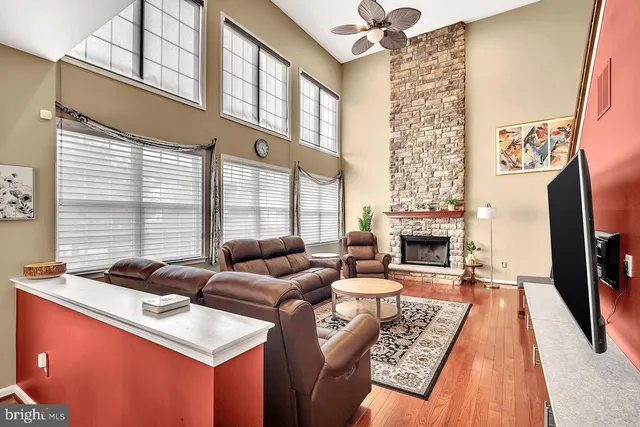 a living room with fireplace furniture and a flat screen tv