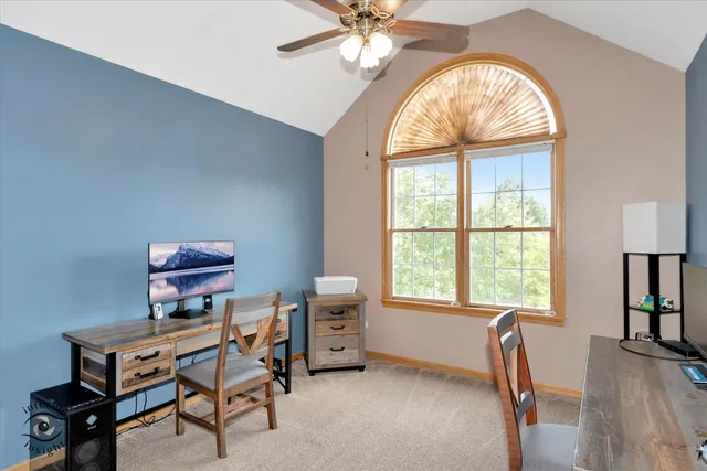 a dining room with furniture and a window
