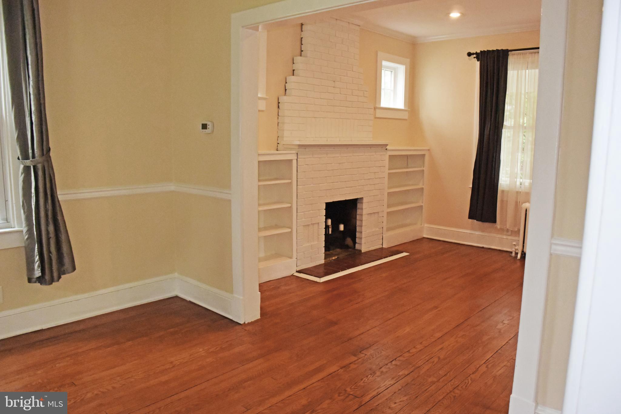 27 West Spring Street Alexandria, VA 22301 - Photo 3 of 29 Living room with wood burning fireplace