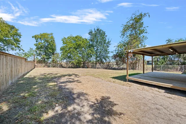 a view of backyard with green space