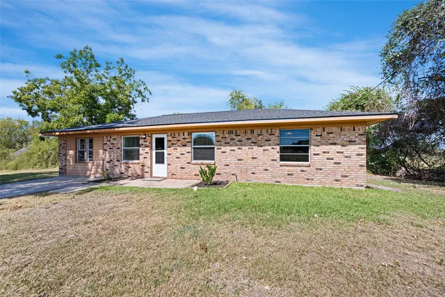 front view of a house with a big yard