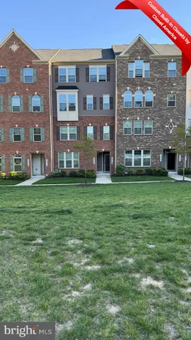 a view of a building with a yard