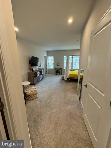 a view of a livingroom with furniture and a flat screen tv