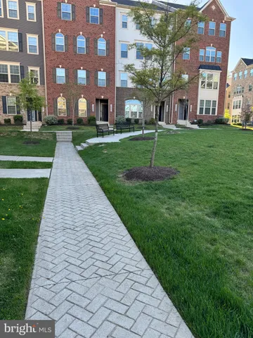 a view of a building with a yard