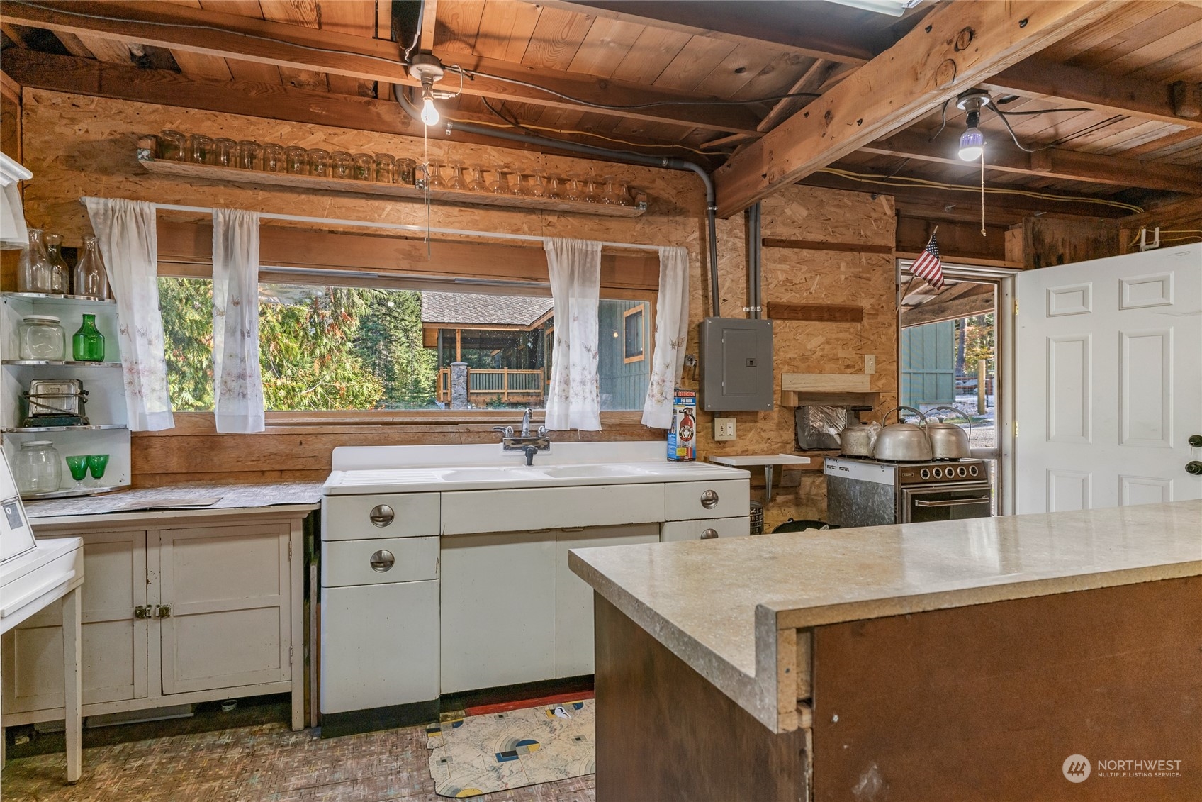 15231 Cedar Brae Road Leavenworth, WA 98826 - Photo 6 of 24 a kitchen with a sink and cabinets