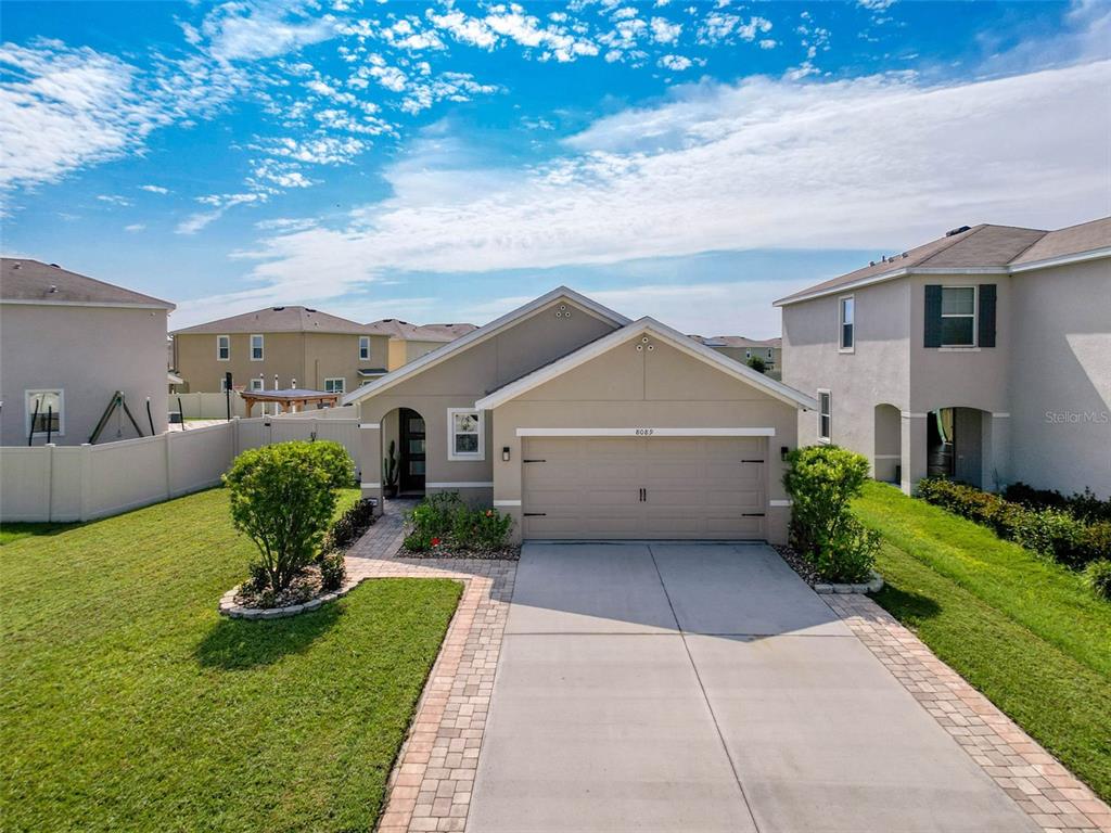 8089 Pelican Reed Circle Wesley Chapel, FL 33545 - Photo 1 of 1 a front view of a house with garden