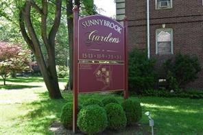 3 Sunnybrook Road, Unit 3B Bronxville, NY 10708 - Photo 1 of 1 a sign that is sitting on a brick wall