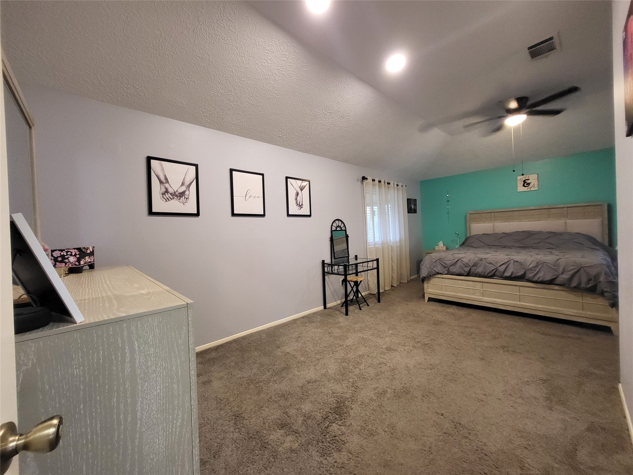9406 Walnut Glen Drive Houston, TX 77064 - Photo 13 of 20 a bedroom with a bed and a cabinets