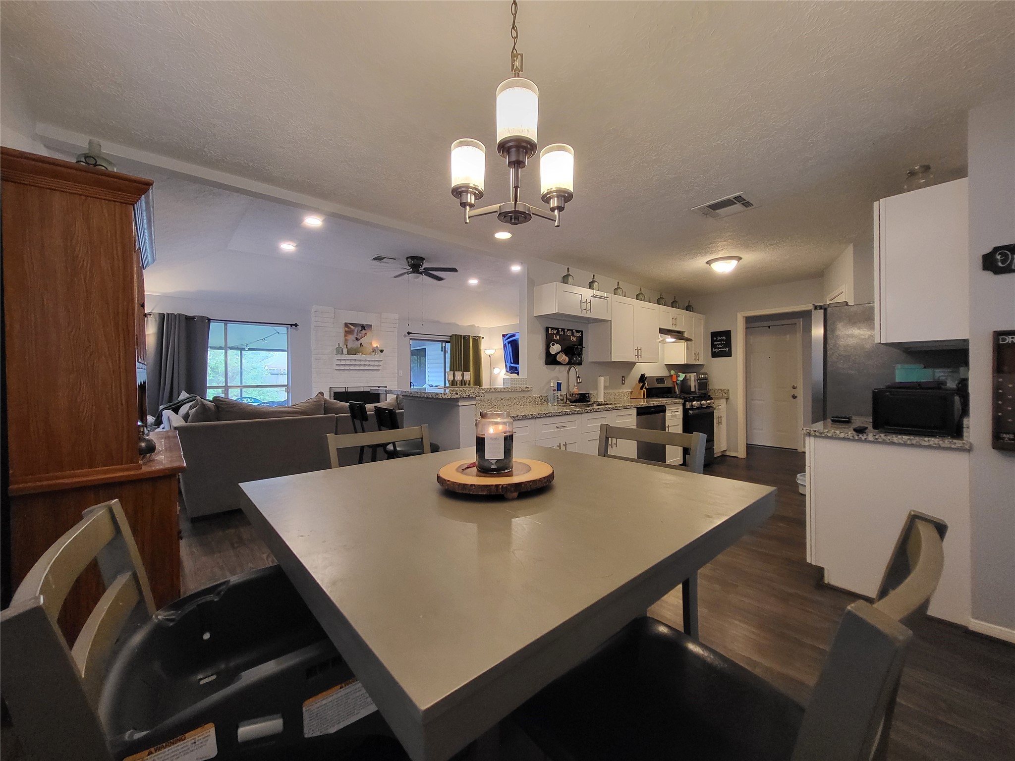 9406 Walnut Glen Drive Houston, TX 77064 - Photo 5 of 20 a view of a dining room with furniture and a kitchen