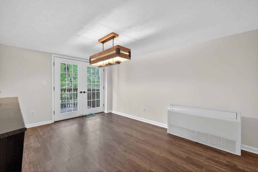 256 Robin Hood Ln N East Fairmount, GA 30139 - Photo 20 of 52 an empty room with wooden floor and windows