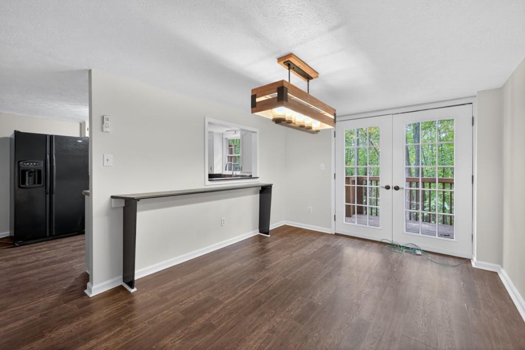 256 Robin Hood Ln N East Fairmount, GA 30139 - Photo 21 of 52 a view of an empty room with a window and wooden floor