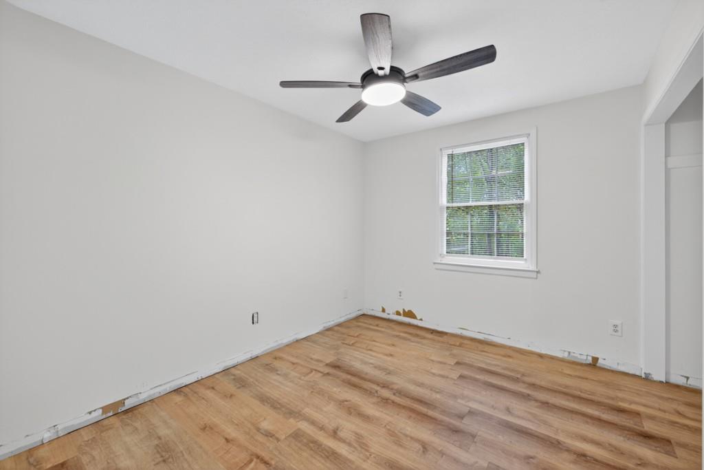 256 Robin Hood Ln N East Fairmount, GA 30139 - Photo 27 of 52 wooden floor in an empty room with a window