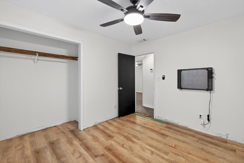256 Robin Hood Ln N East Fairmount, GA 30139 - Photo 28 of 52 a bedroom with a bed and a ceiling fan