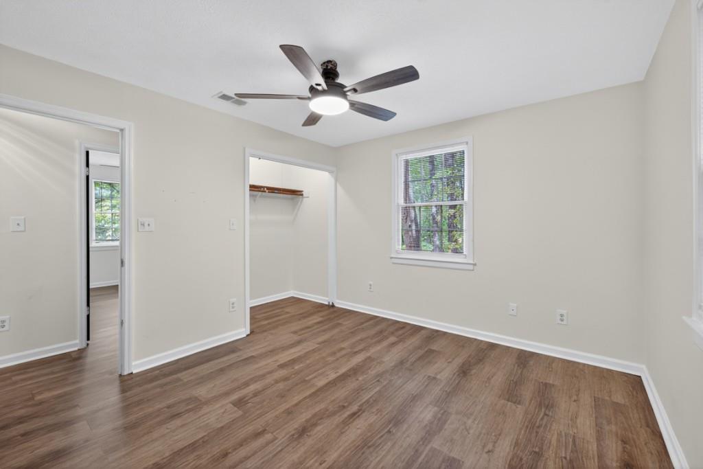 256 Robin Hood Ln N East Fairmount, GA 30139 - Photo 35 of 52 a view of an empty room with wooden floor and a window