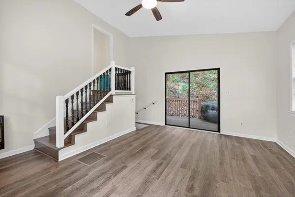 a view of an entryway with wooden floor