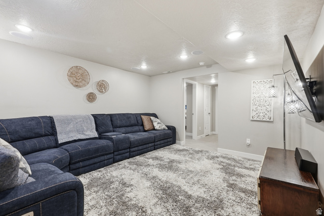 3244 West 1670th Street North Provo, UT 84601 - Photo 41 of 56 Open-concept living area featuring recessed ceiling lighting, light gray wall paint, and plush carpeting