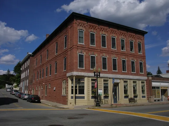 a front view of a building with street view