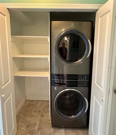 a utility room with washing machine
