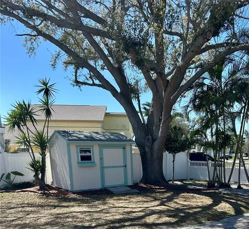a view of a house with a tree