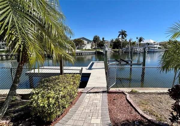a view of a park with large trees