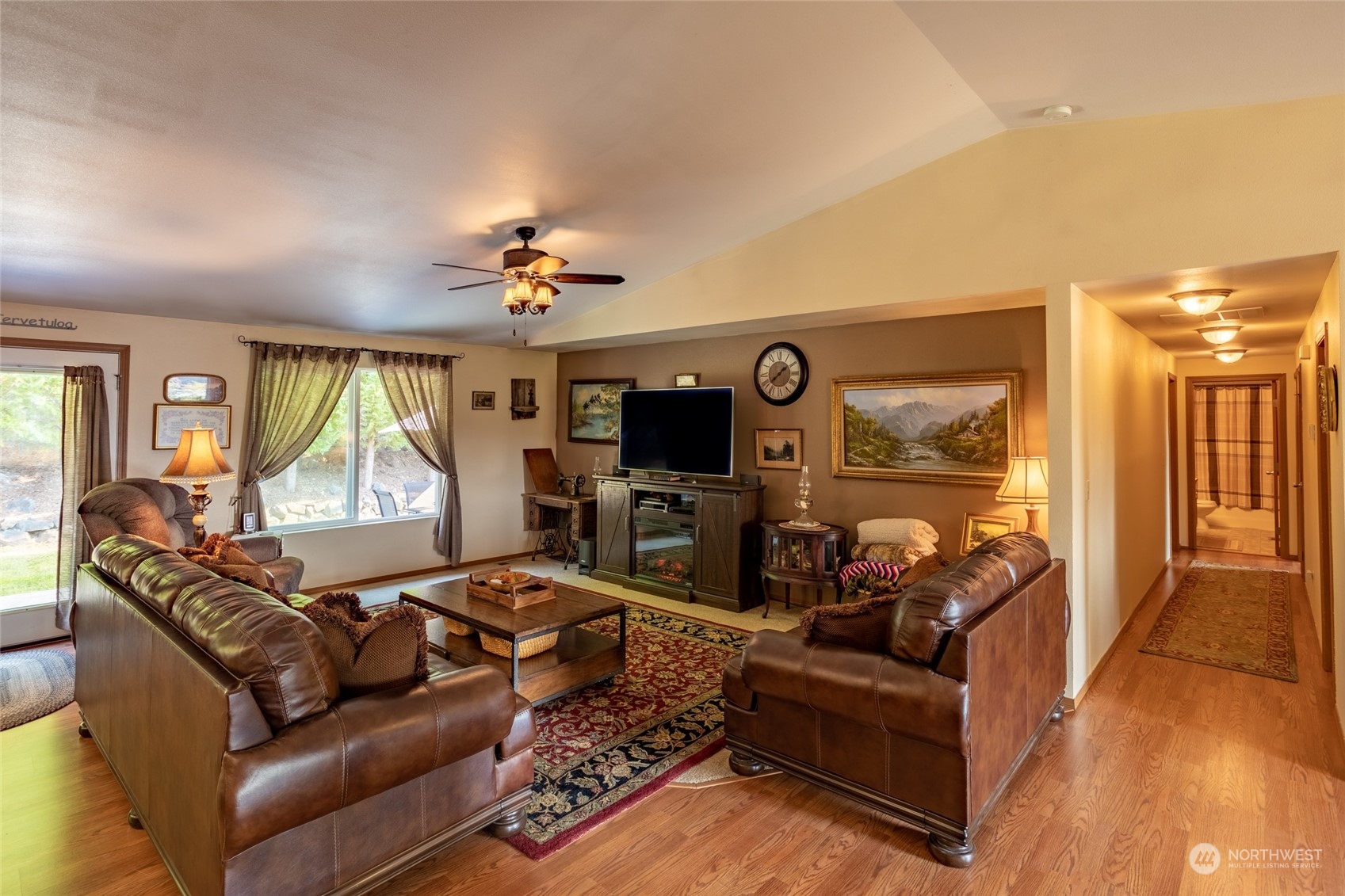 526 Haywire Road Napavine, WA 98532 - Photo 18 of 40 a living room with furniture fireplace and a flat screen tv