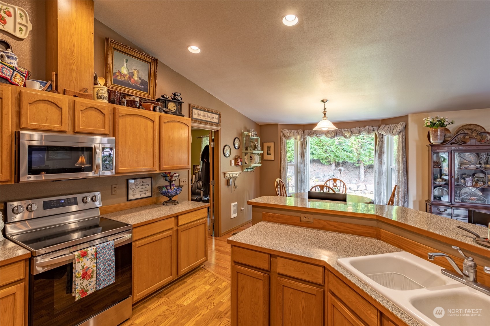 526 Haywire Road Napavine, WA 98532 - Photo 22 of 40 a kitchen with stainless steel appliances granite countertop a sink a stove and a refrigerator
