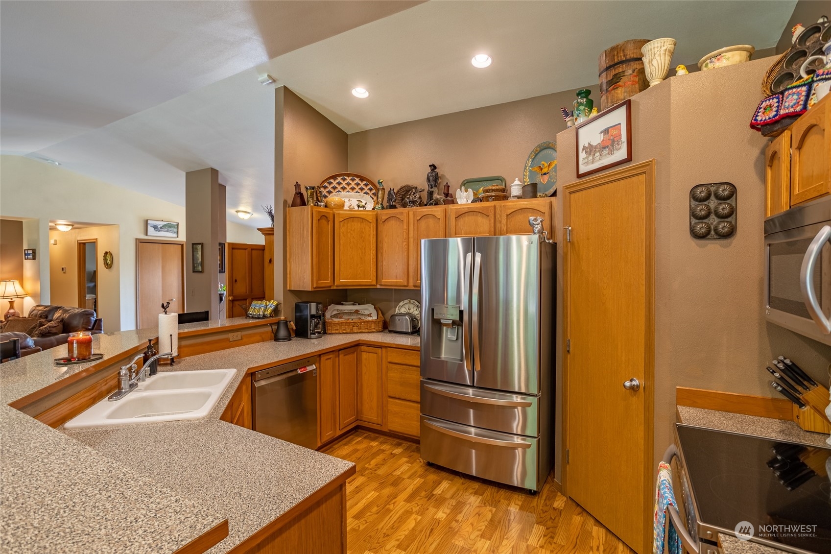 526 Haywire Road Napavine, WA 98532 - Photo 23 of 40 a kitchen with stainless steel appliances a sink and a refrigerator