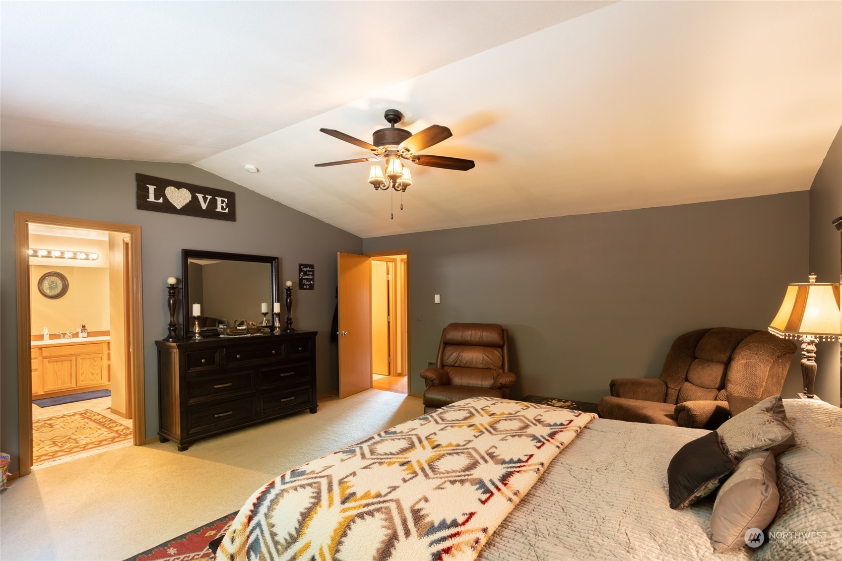 526 Haywire Road Napavine, WA 98532 - Photo 26 of 40 a bedroom with a bed and a chandelier