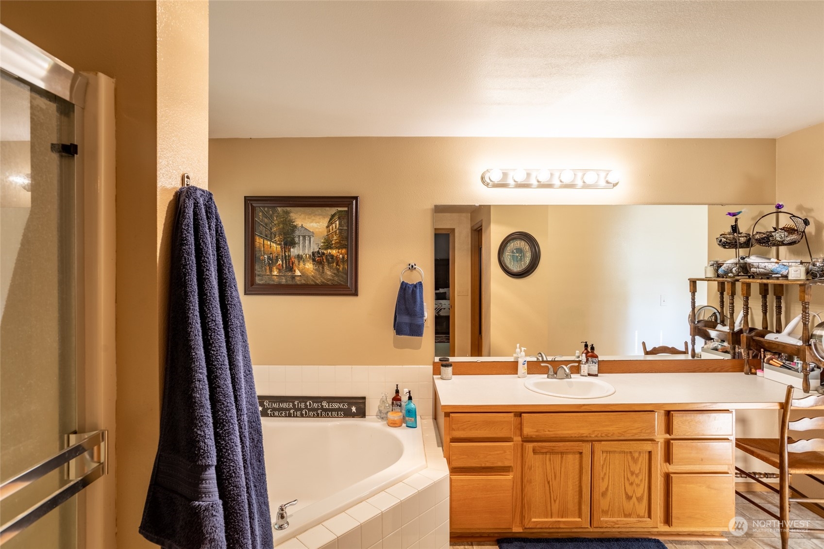 526 Haywire Road Napavine, WA 98532 - Photo 29 of 40 a bathroom with a sink a mirror and a bathtub